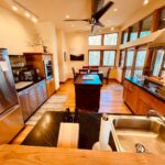 Your fully equipped kitchen with dining room next to the convenient walk out screened porch.